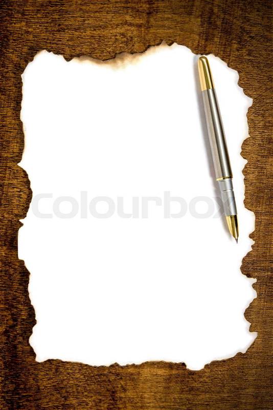 Burnt paper with pen, stock photo