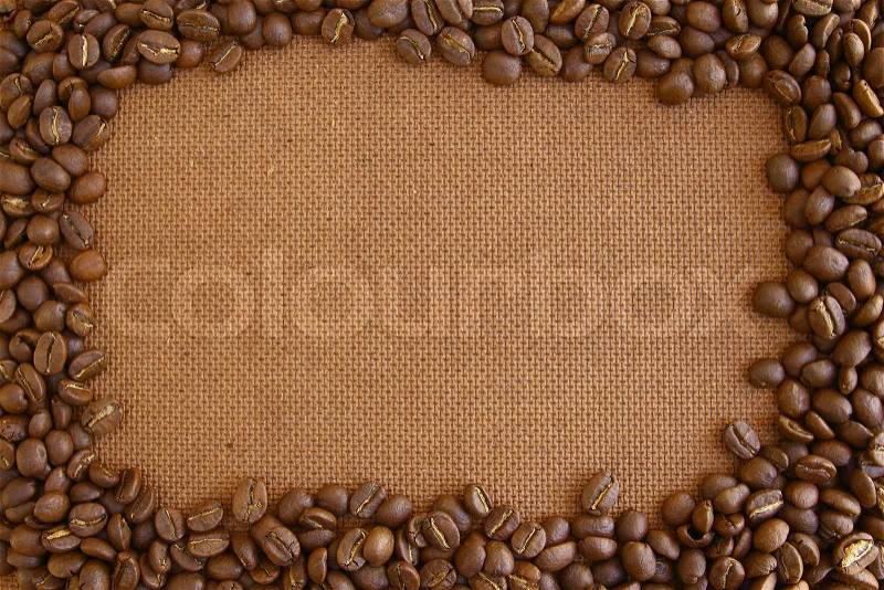 Coffee beans frame on grunge wooden board background, stock photo