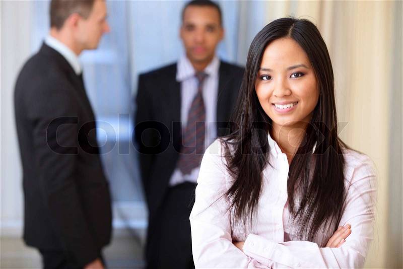 Portrait of a young beautiful asian woman in a business environment, stock photo