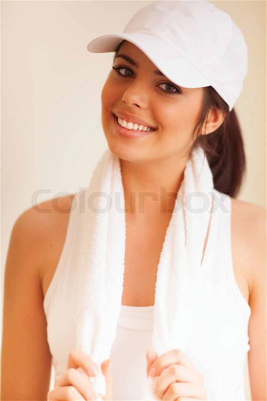 Portrait of a young beautiful sport woman with towel, stock photo