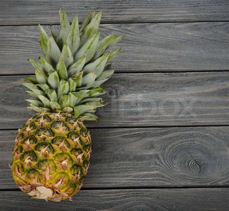 Pineapple on a gray background, stock photo