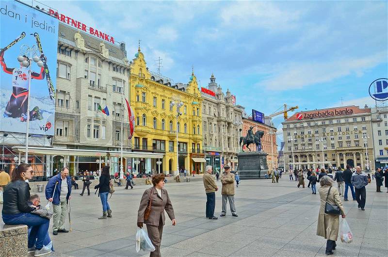 ZAGREB - MARCH 18: Unidentified people on main city square Ban Jelacic square on March 18, 2012 in Zagreb, Croatia. Many tourists visit Ban Jelacic square, which is located in old city core, stock photo