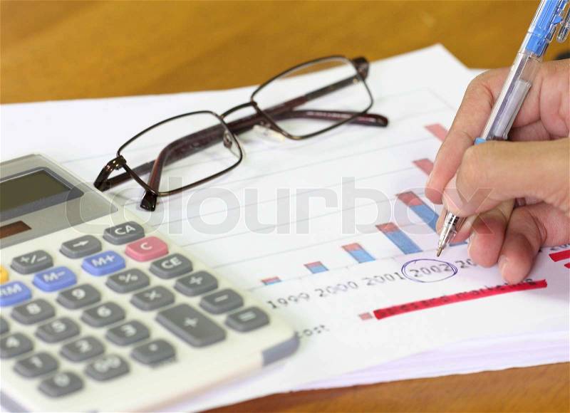 Finance budget report with hand of someone, stock photo