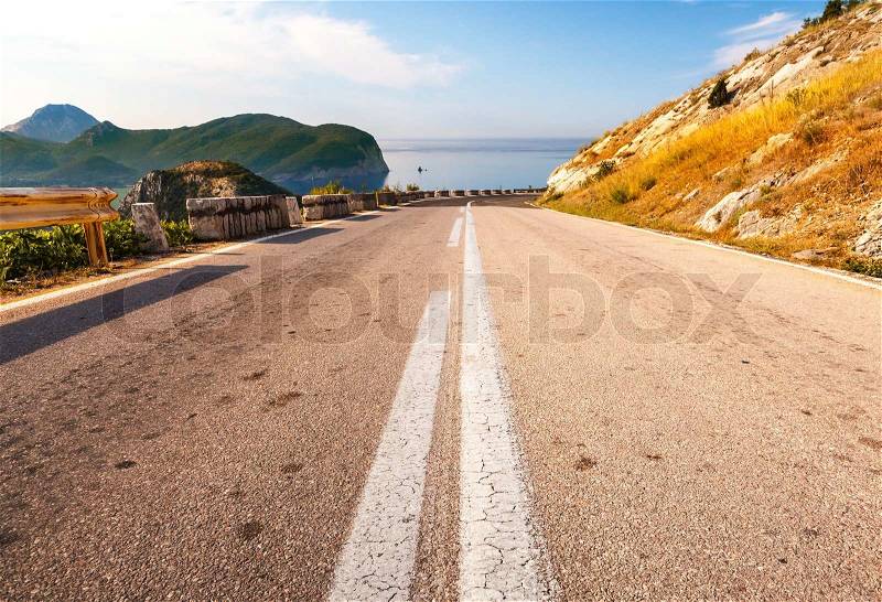Double dividing line on the coastal mountain highway in Montenegro, stock photo