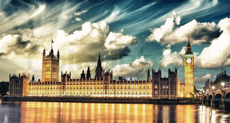 Big Ben and House of Parliament at River Thames International Landmark of London England at Dusk with clouds - UK, stock photo