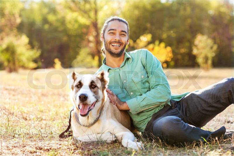 Man and central Asian shepherd, stock photo