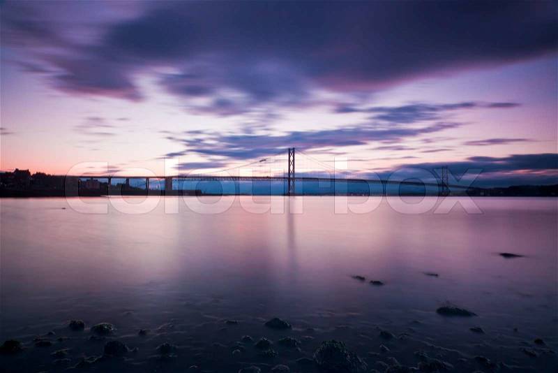 The Forth Road Bridge at dusk in Edinburgh, South Quennsferry, Scotland, stock photo