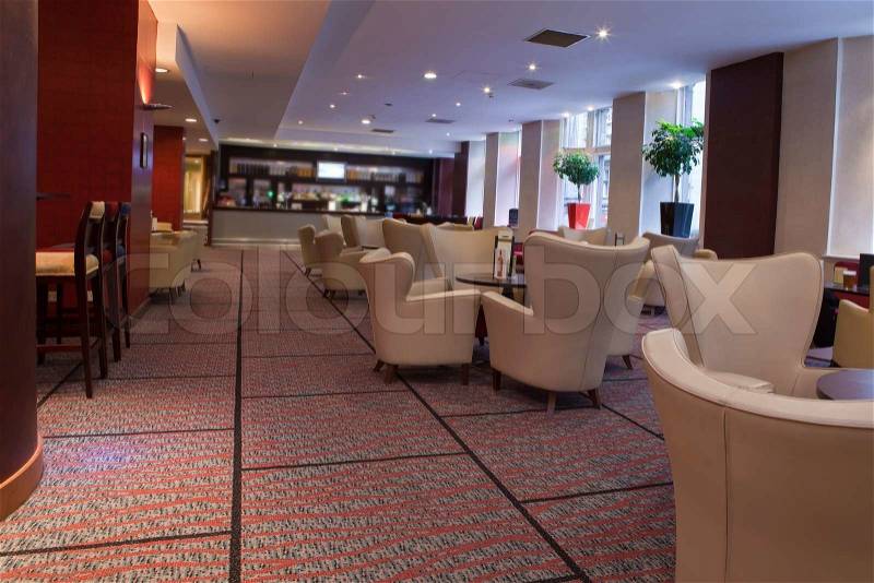 Hotel\'s bar with chairs and tables to sit and relax, stock photo
