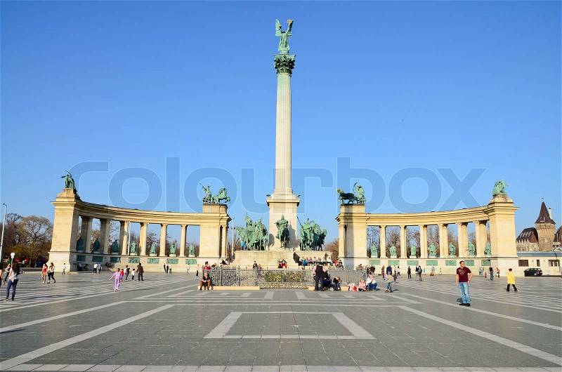BUDAPEST -26 MARCH 2012: Tourists visit Millennium Monument in Heroes Square circa 26 March 2012 in Budapest, Hungary This square has been UNESCO World Heritage site since 2002, stock photo
