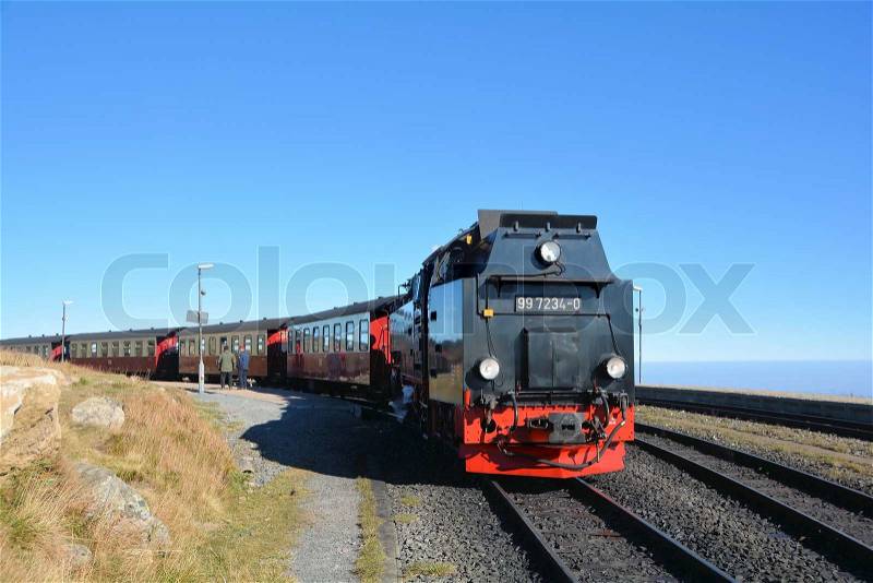 A steam locomotive on the Brocken Railway runs from the summit of the Brocken in the Harz National Park, the valley, stock photo