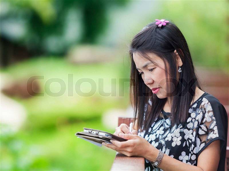 Woman Using Ipad, Outdoor, stock photo