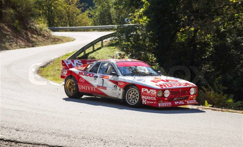 Vic, SPAIN - OCTOBER 12 : Spanish driver Pedro and his codriver in a Lancia Rally 037 race in the 61nd Rally Costa Brava, on October 12, 2013 in Vic, Spain, stock photo