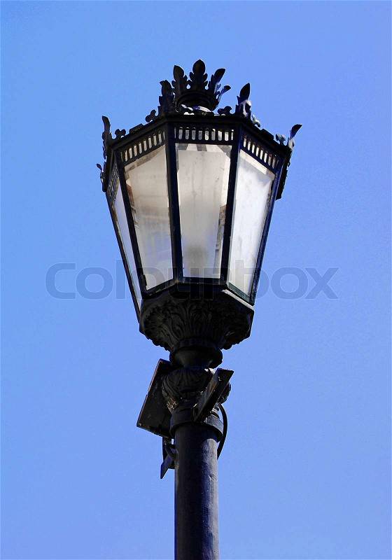 Vintage lamp post against a blue sky background Lisbon, stock photo