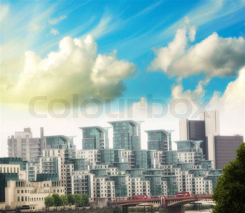 London, UK. City buildings seen from St George Wharf Riverside Walk, stock photo