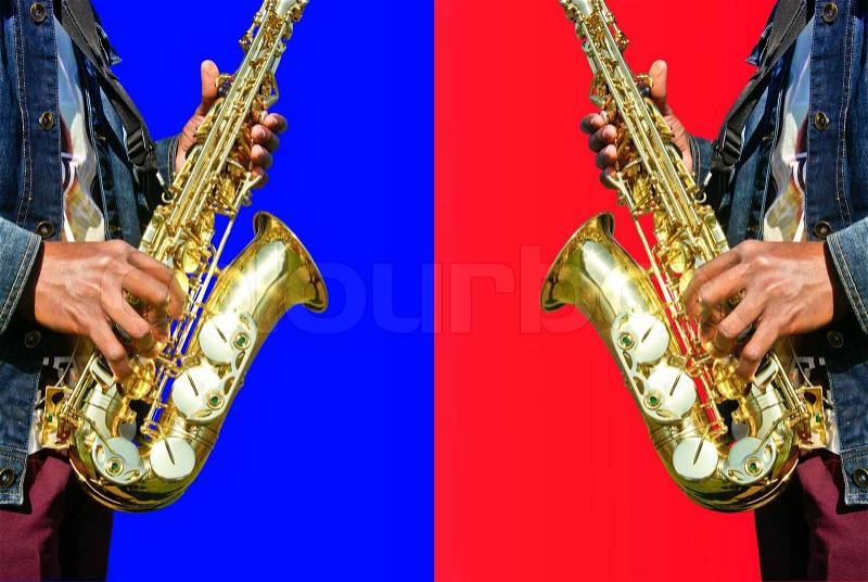 Playing the saxophone in a red and blue background, stock photo