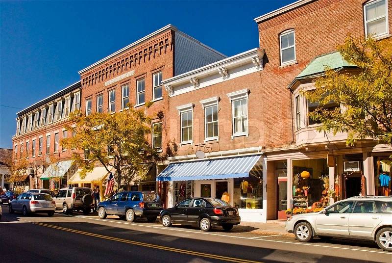 Typical New England or Midwest downtown main street. This street scene could be any small town U.S.A. Old brick buildings turned into small businesses, shops and cafe\'s, stock photo