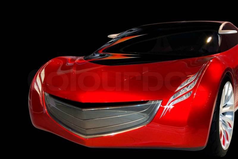 Futuristic red sports car with dramatic styling and colorful lighting. Notice the interesting headlight design. Isolated on a black background. Look in my gallery for more car photos like this, stock photo