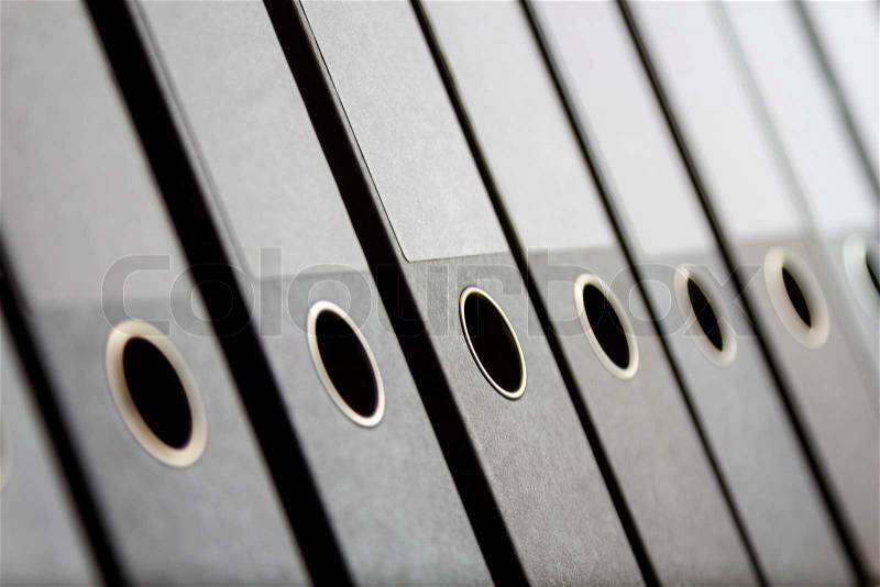 A Row of binders in an office archive, shallow depth of field, stock photo
