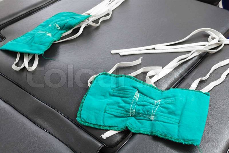 Surgery mask fabric on bed for medical care, stock photo