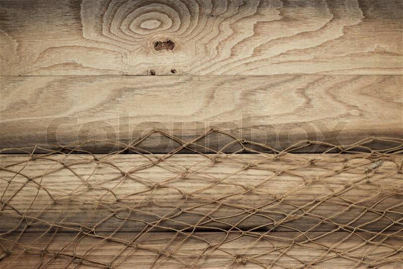 Brown wooden background texture and fishing net, stock photo