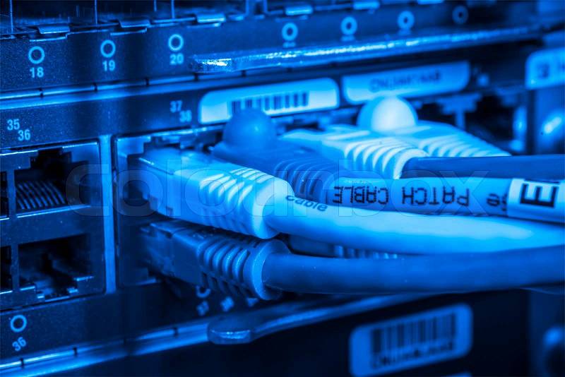 Network hub and patch cables, stock photo