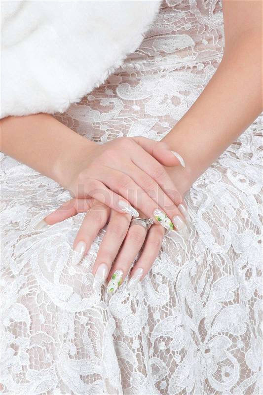 Hands of bride with manicure, stock photo