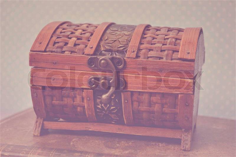 Decorative chest box on old book vintage, stock photo