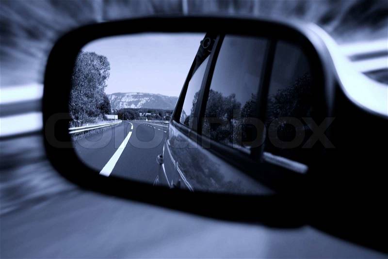 Road seen in a car mirror, stock photo