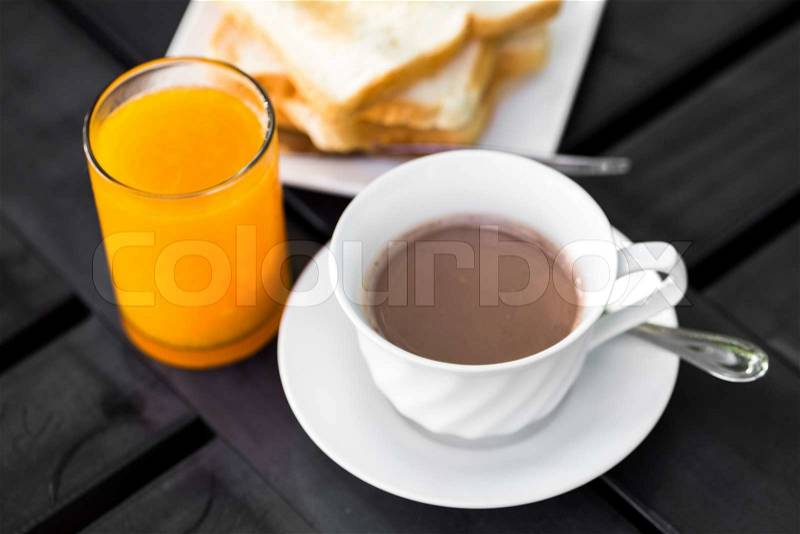 Breakfast with toast, coffee and orange juice, stock photo