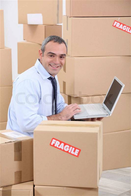 Man with cardboard boxes, stock photo