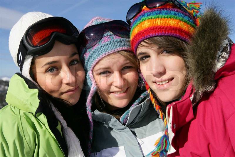 Three friends skiing, stock photo