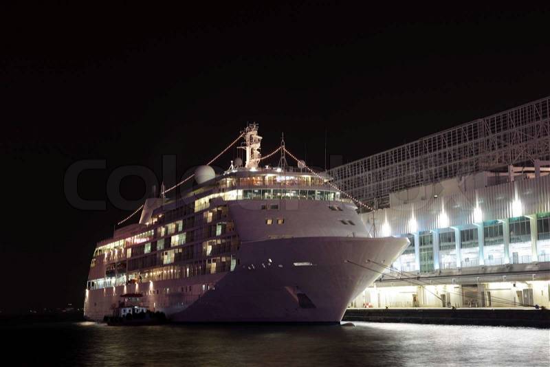 Cruise liner in Hong Kong at night, stock photo