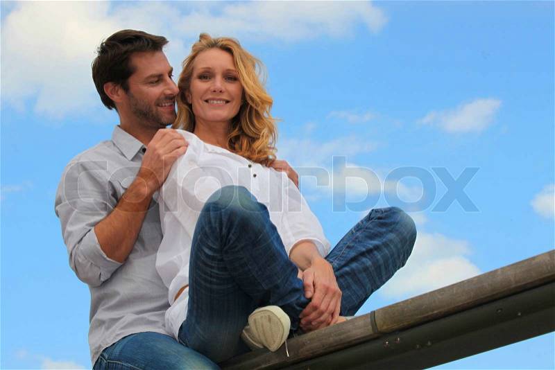 Couple on see-saw, stock photo