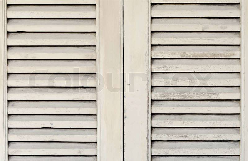 Wooden window with shutters closed, stock photo