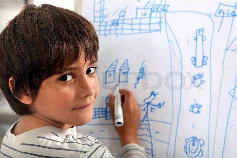 Child drawing a street scene, stock photo