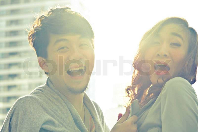 Young carefree couple laughing, stock photo