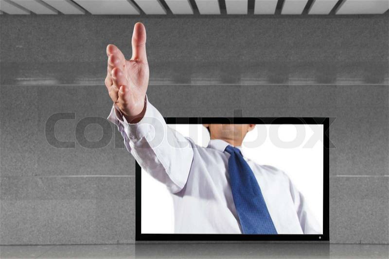 Business handshake at the TV screen, stock photo