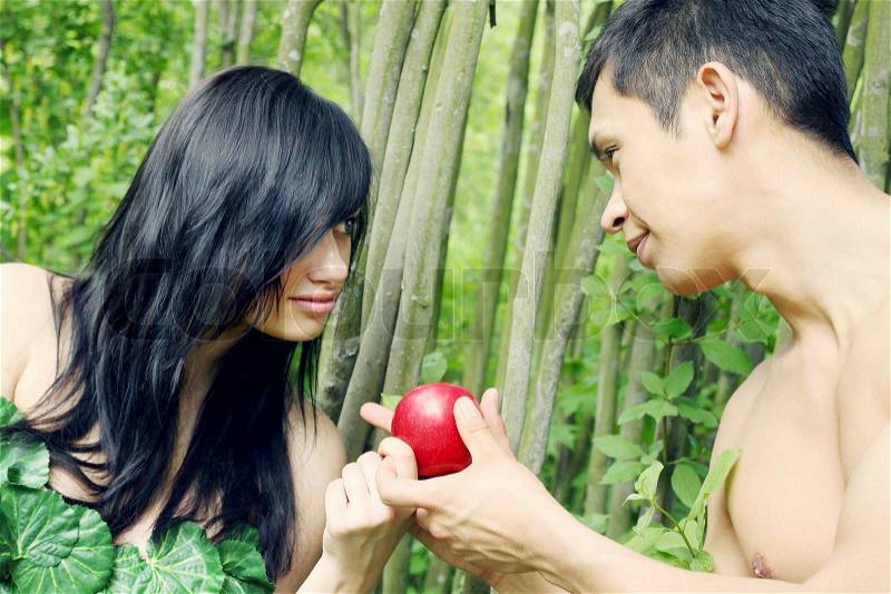 Adam and Eve are going to eat an apple, stock photo