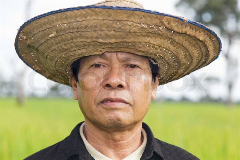 Close-up of Farmer face in the rice field, stock photo