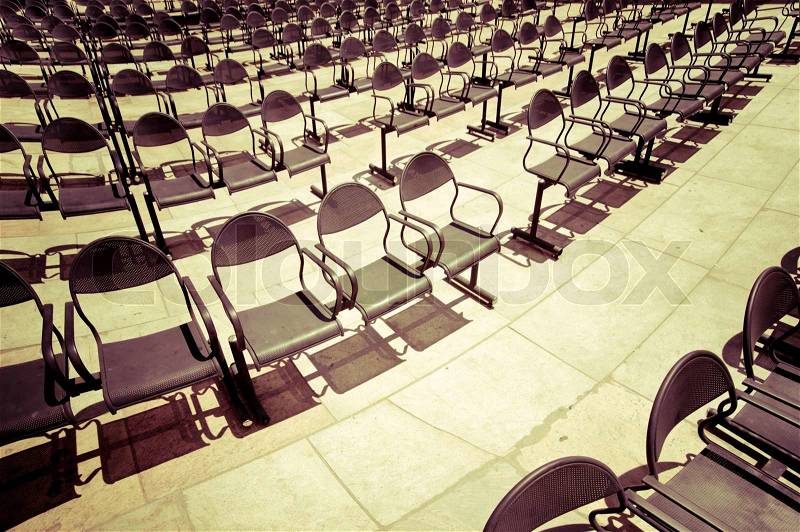 Rows of chairs at outdoors concert hall. Vintage style processing image, stock photo