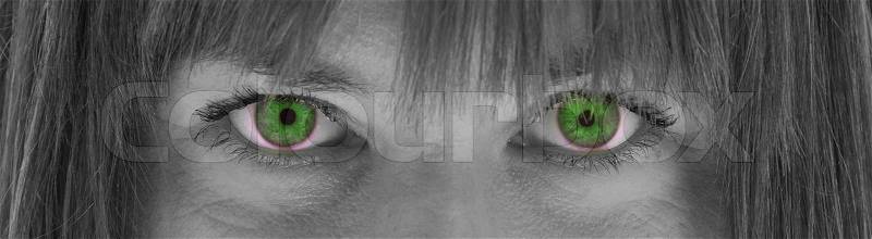 Close-up of the eyes, young woman, black and white, evil green eyes, stock photo