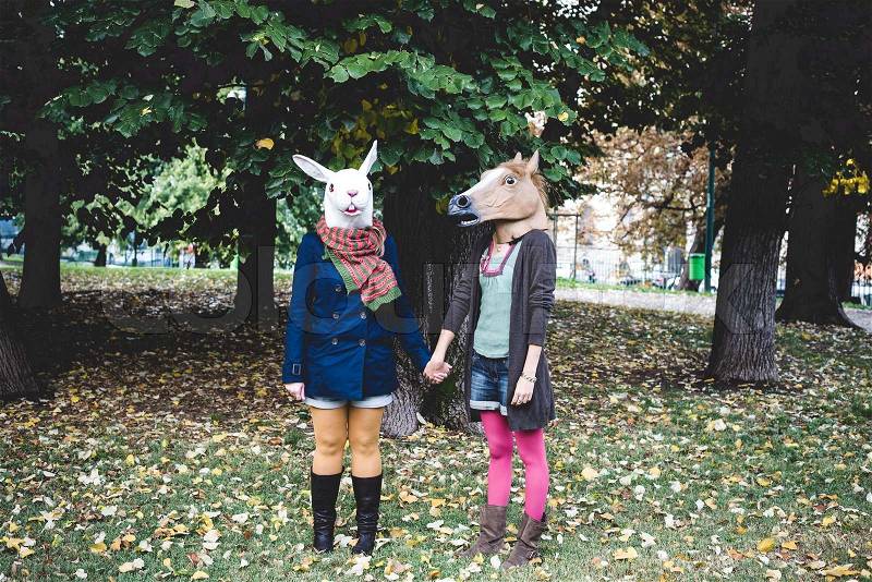 Horse and rabbit mask women in the park autumn, stock photo