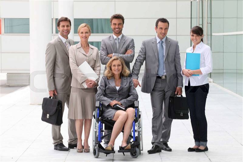 Business people stood outside building, stock photo