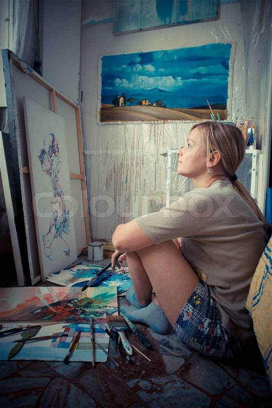 Beautiful blonde woman painter, stock photo