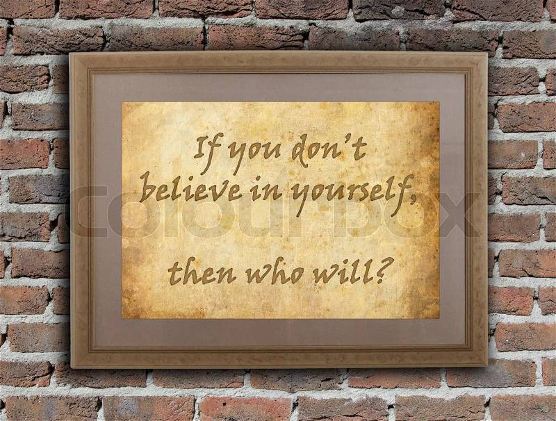 Old wooden frame with written text on an old wall - Believe in yourself, stock photo
