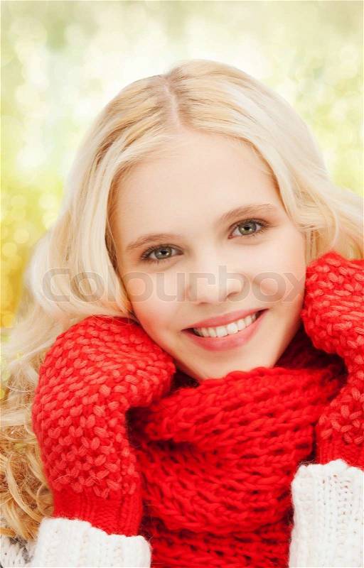 Winter, christmas, xmas, x-mas, people, happiness concept - teenage girl in red mittens and scarf, stock photo