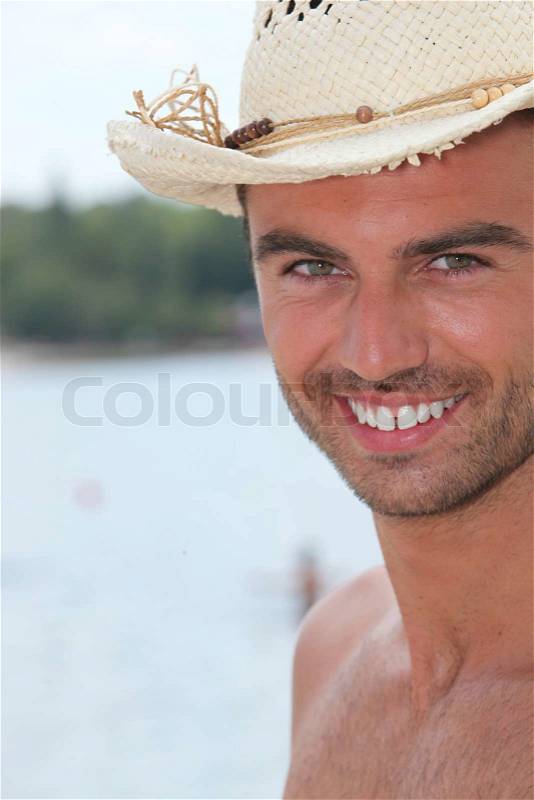 Portrait of a man with straw hat, stock photo