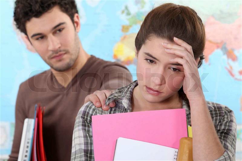 Student supporting another, stock photo