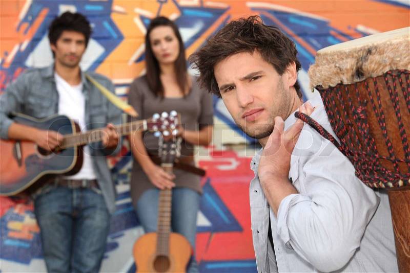 Young people with guitars and drums, stock photo