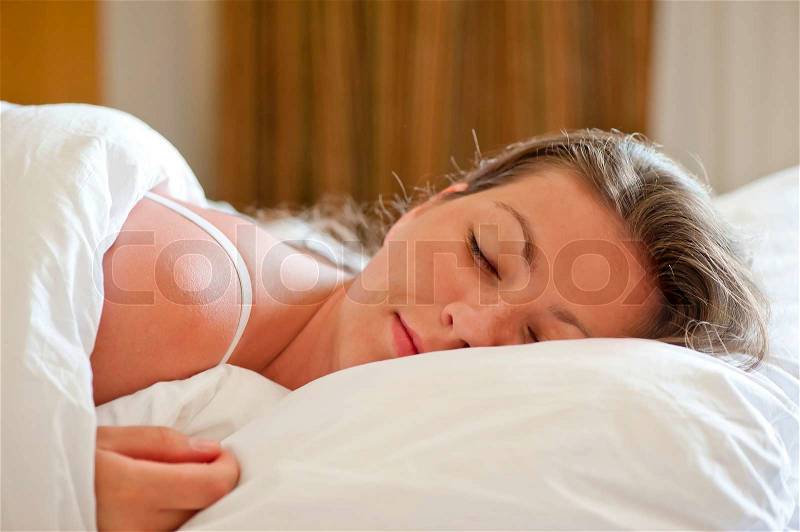 Early in the morning a beautiful girl sleeps, stock photo